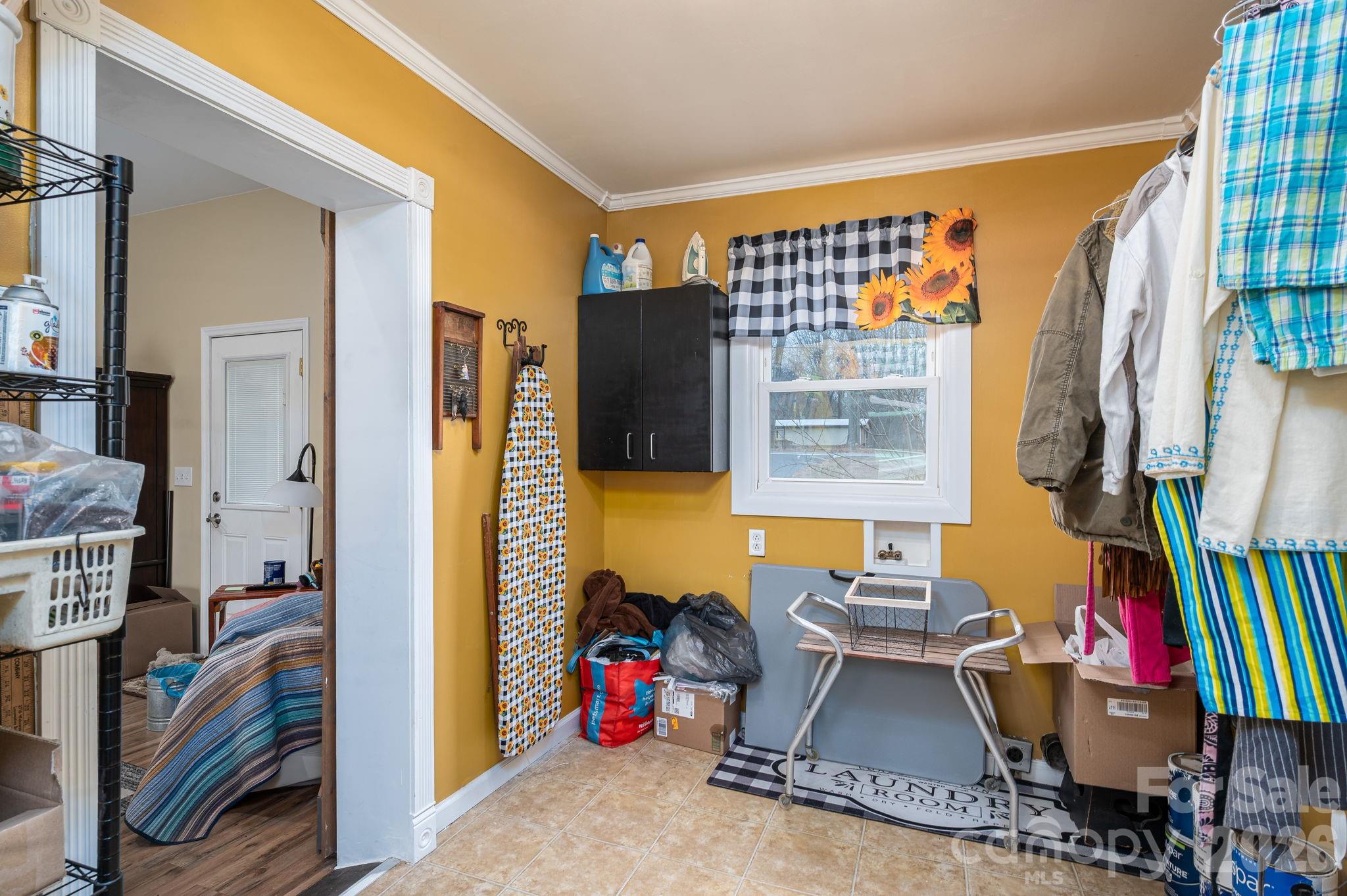 2033 Puetts Chapel Road Bessemer City, NC 28016 - Photo 24 of 38 a living room with furniture a flat screen tv and a large window