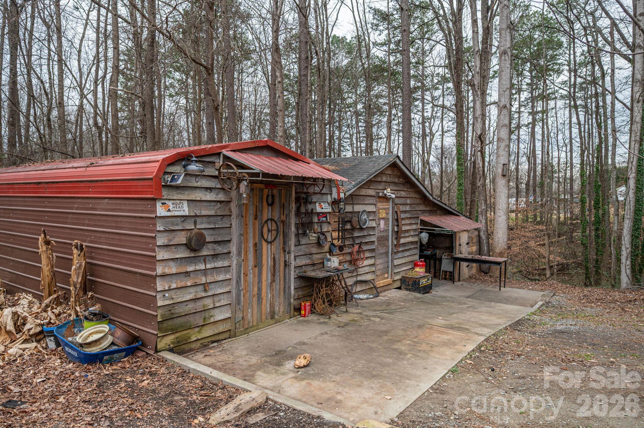 2033 Puetts Chapel Road Bessemer City, NC 28016 - Photo 31 of 38 a view of a house with a yard and furniture