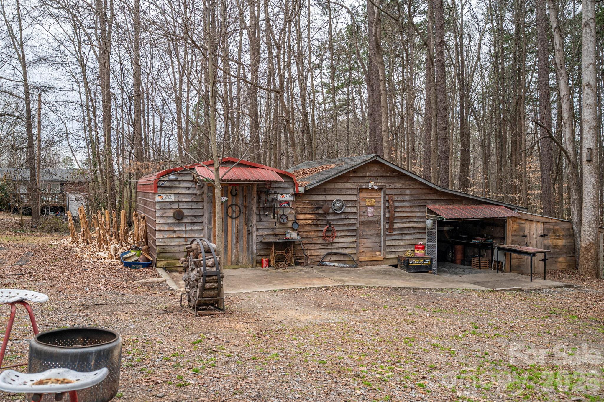 2033 Puetts Chapel Road Bessemer City, NC 28016 - Photo 32 of 38 a view of a house with a yard and a large tree