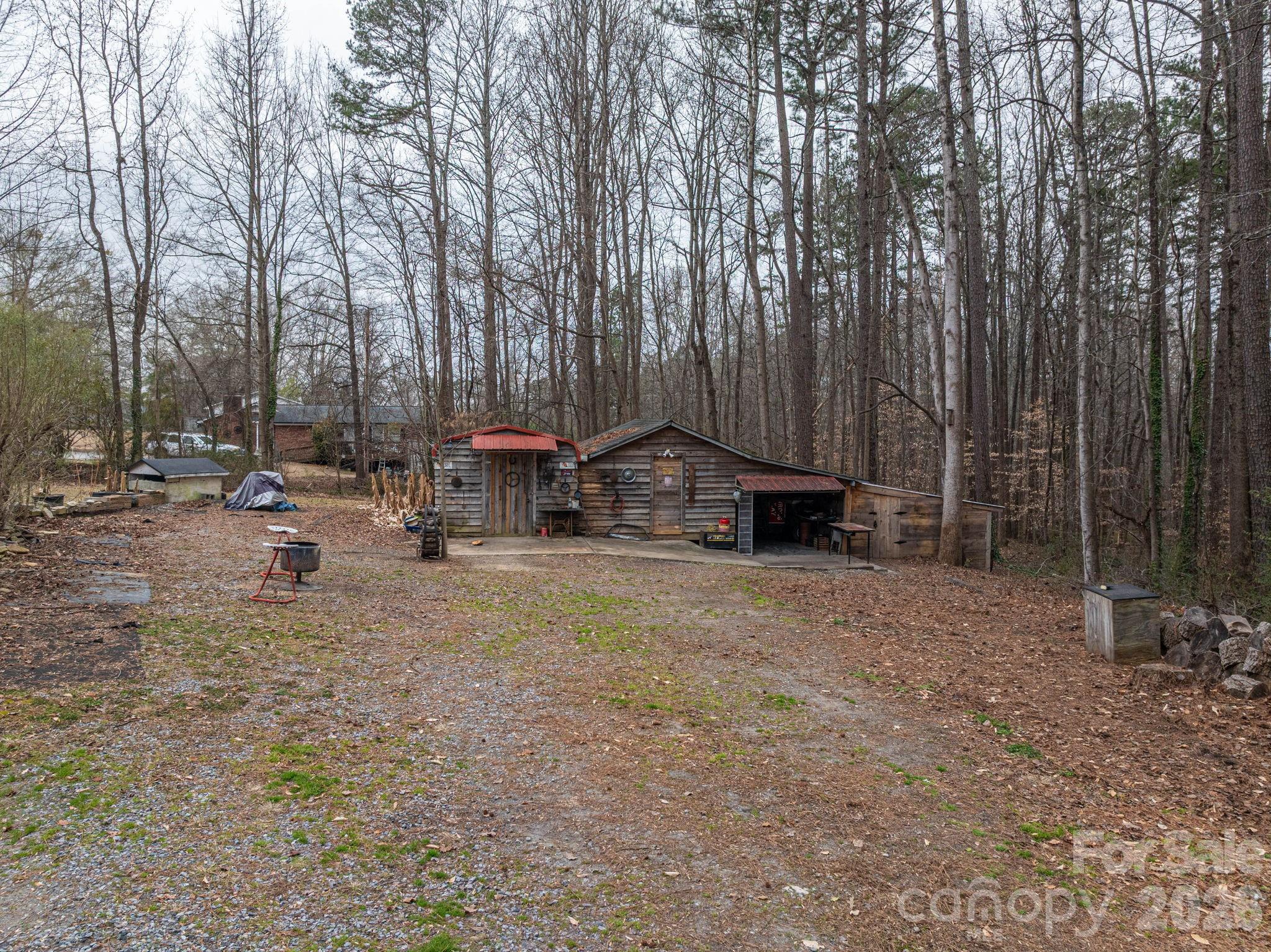 2033 Puetts Chapel Road Bessemer City, NC 28016 - Photo 36 of 38 a backyard of a house with table and chairs