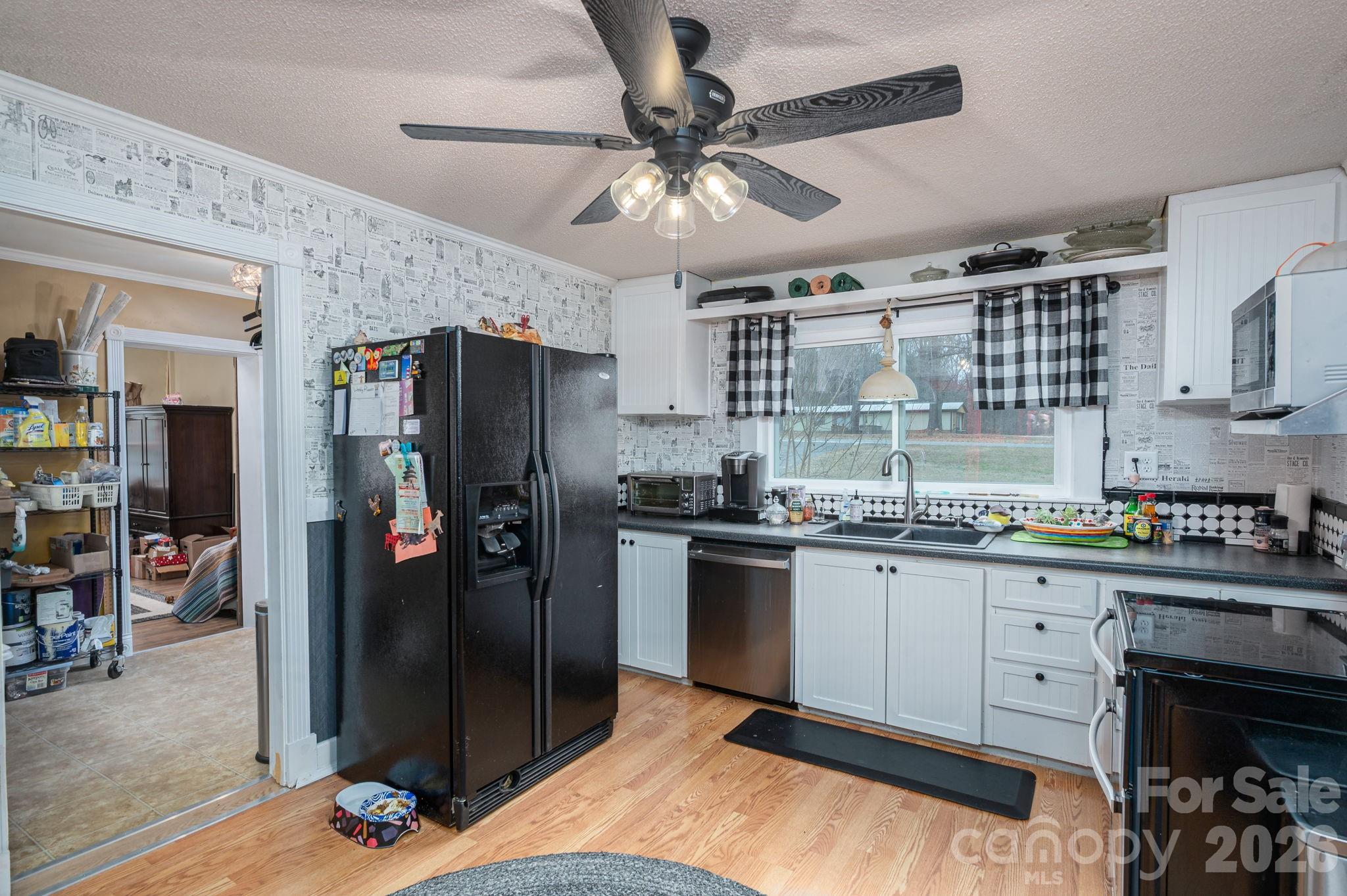 2033 Puetts Chapel Road Bessemer City, NC 28016 - Photo 4 of 38 a kitchen with granite countertop a refrigerator stove top oven and sink