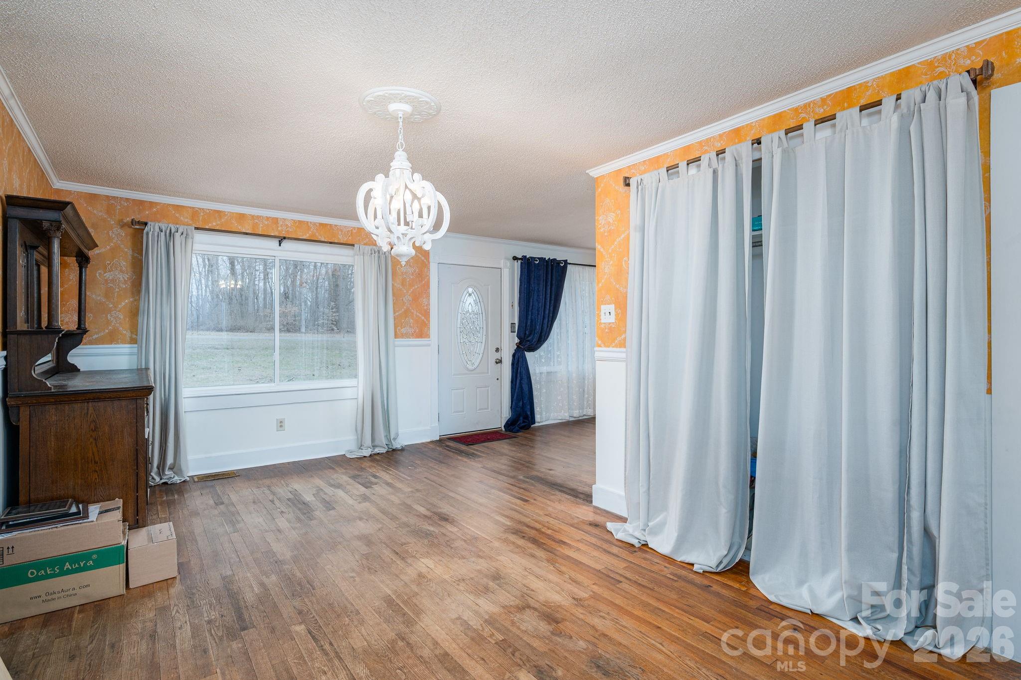 2033 Puetts Chapel Road Bessemer City, NC 28016 - Photo 9 of 38 a view of a room with wooden floor and stairs