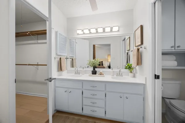 a bathroom with a toilet and a sink
