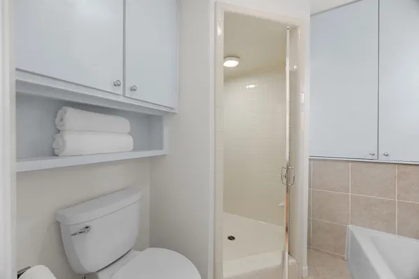 a white bath tub sitting next to a window