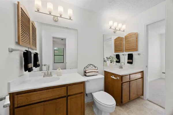 a bathroom with a bathtub a shower and a window