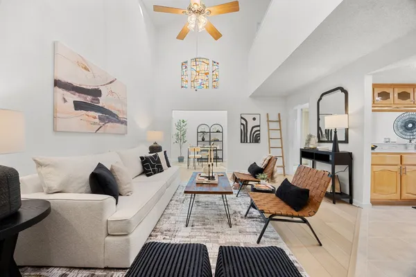 a living room with furniture and a fireplace
