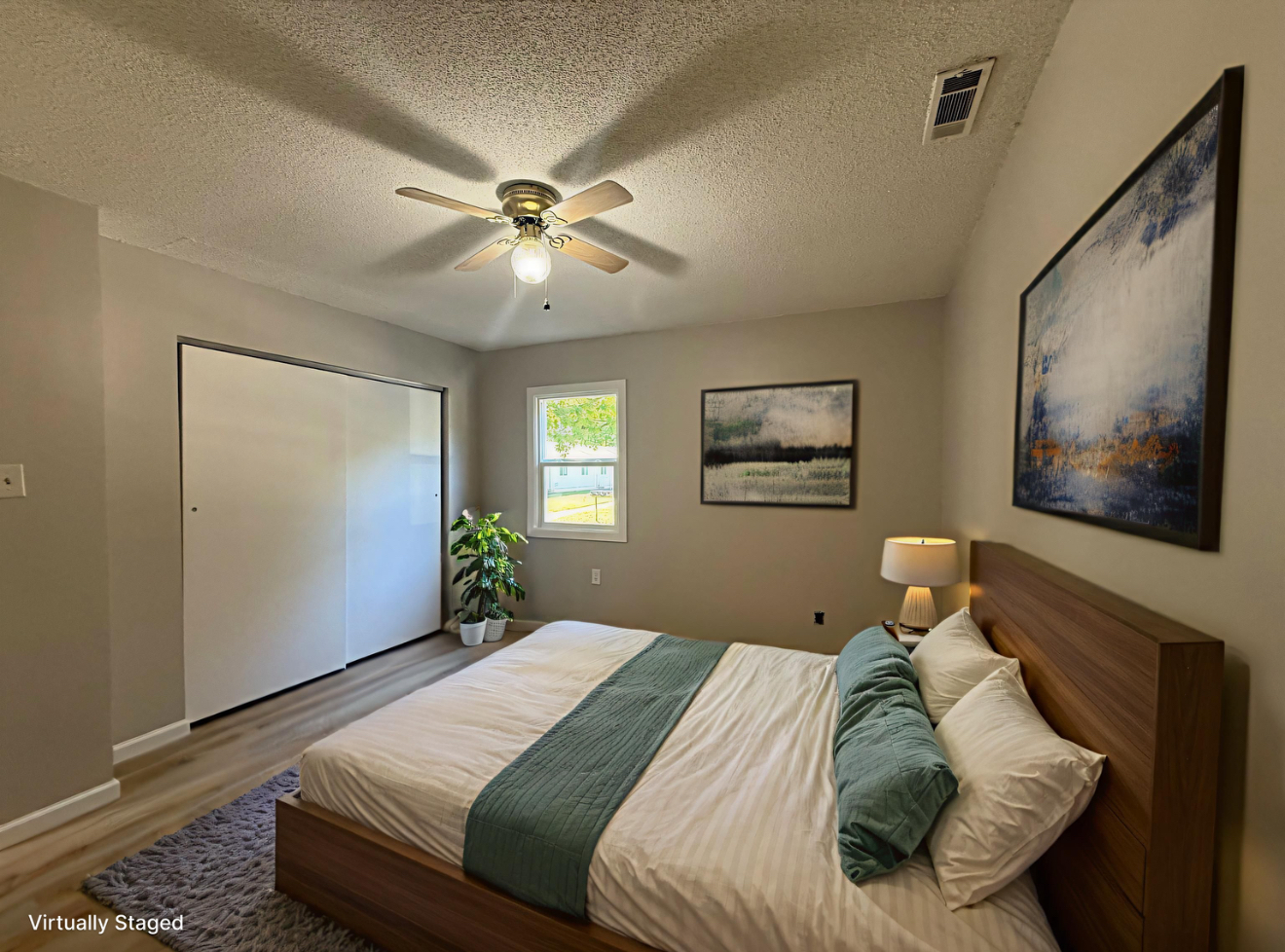 1350 Sebring Way Carbondale, IL 62901 - Photo 10 of 20 a bedroom with a large bed and a chandelier