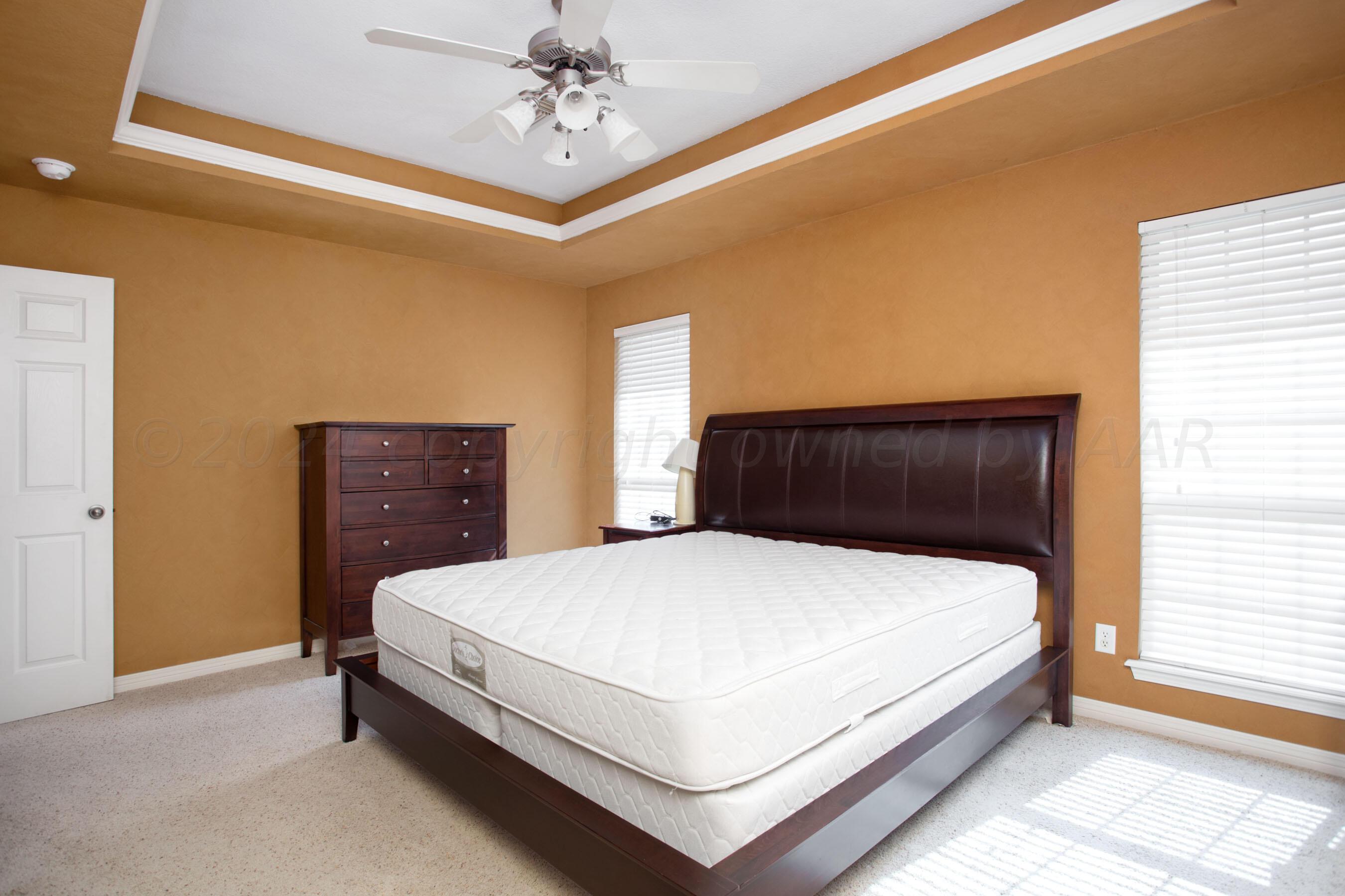 6501 Academy Drive Amarillo, TX 79119 - Photo 12 of 22 a bedroom with a bed and window