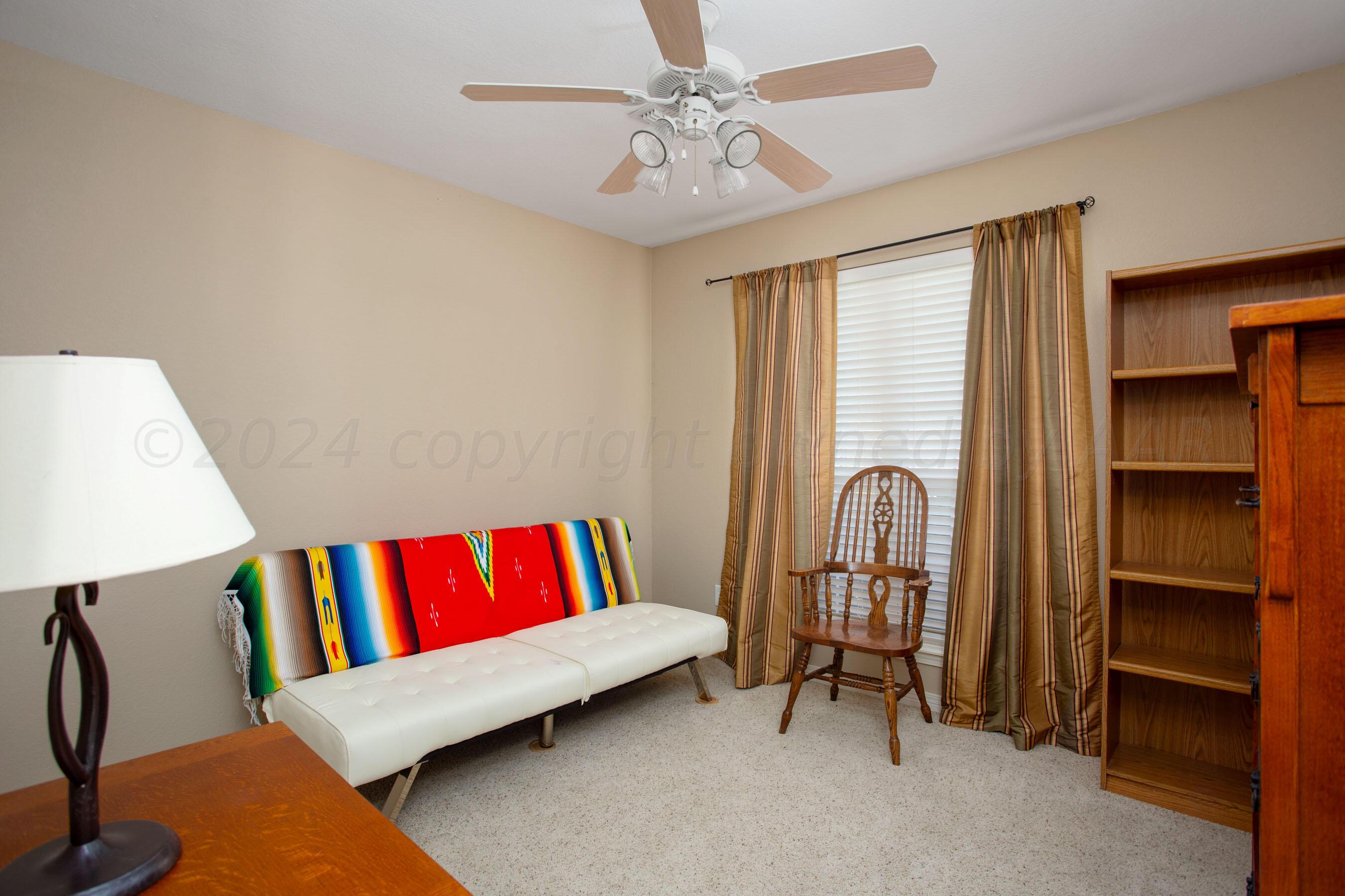 6501 Academy Drive Amarillo, TX 79119 - Photo 18 of 22 a living room with furniture