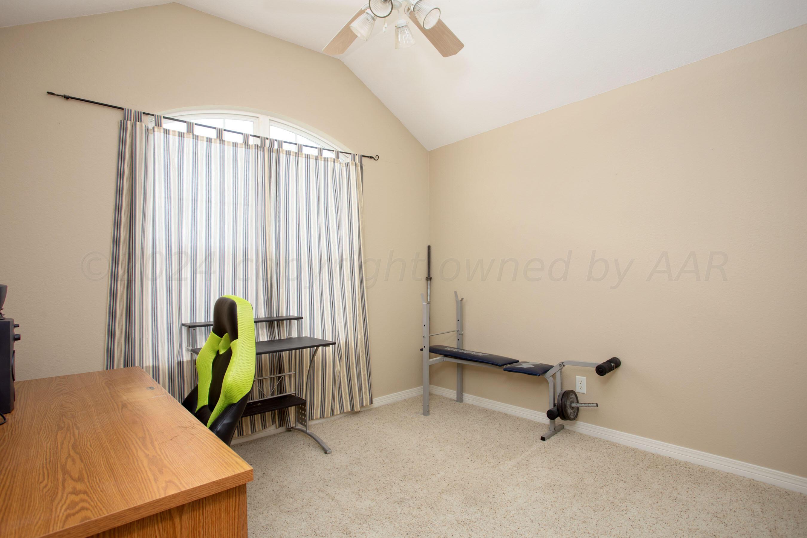 6501 Academy Drive Amarillo, TX 79119 - Photo 19 of 22 a view of a bedroom with a window