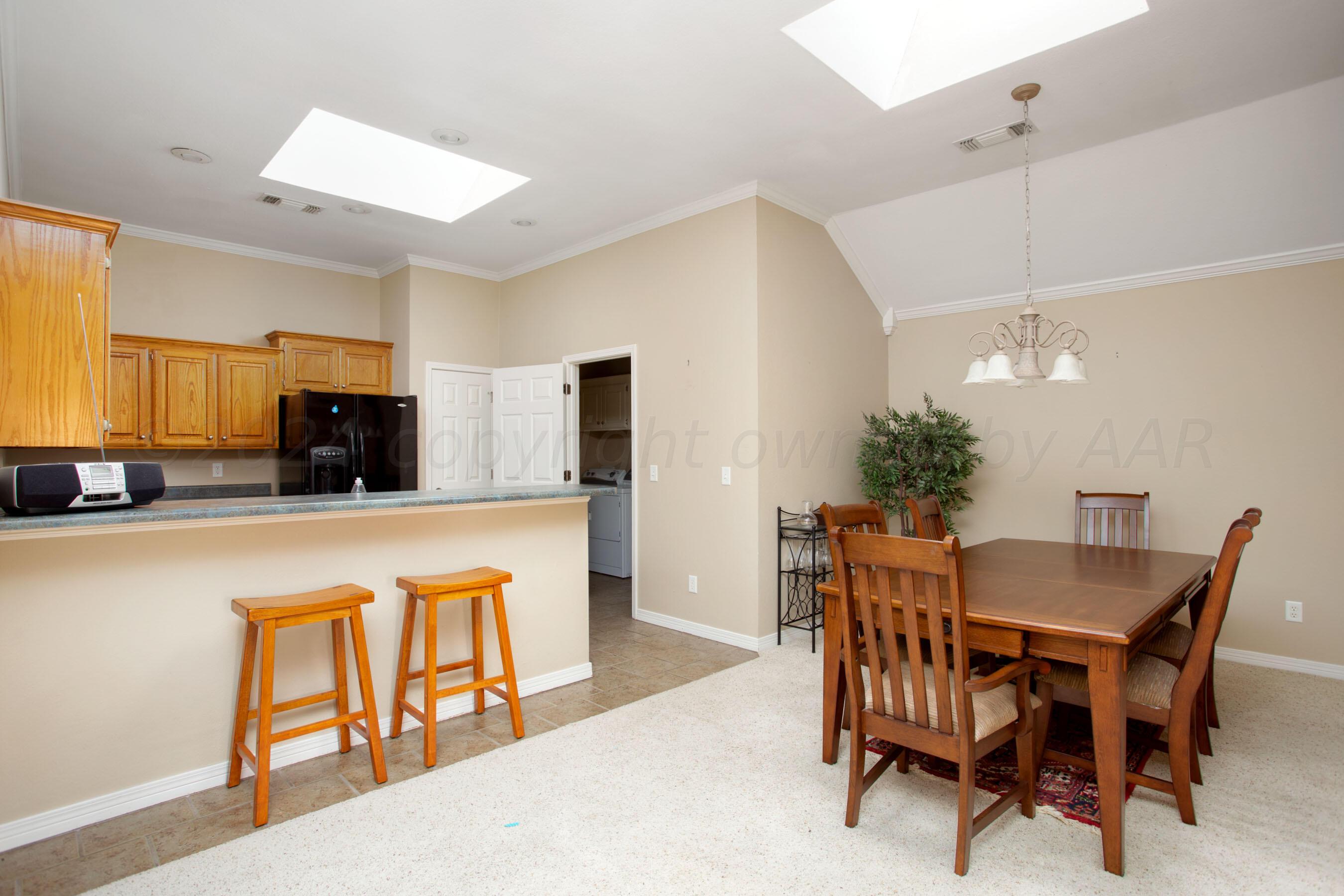 6501 Academy Drive Amarillo, TX 79119 - Photo 9 of 22 a dining room with furniture and window