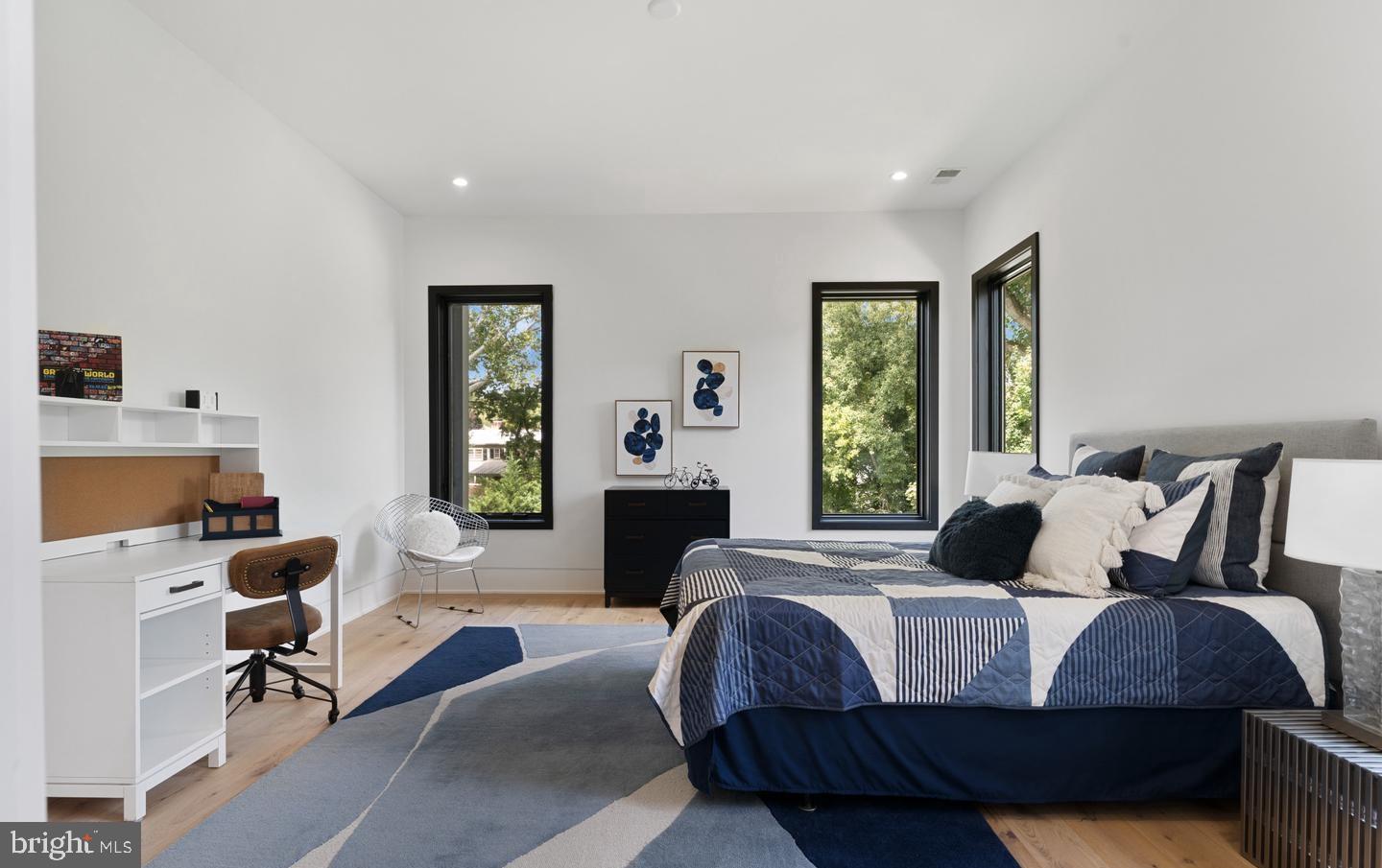 1138 Basil Road McLean, VA 22101 - Photo 21 of 24 Modern serenity in a sunlit bedroom retreat.