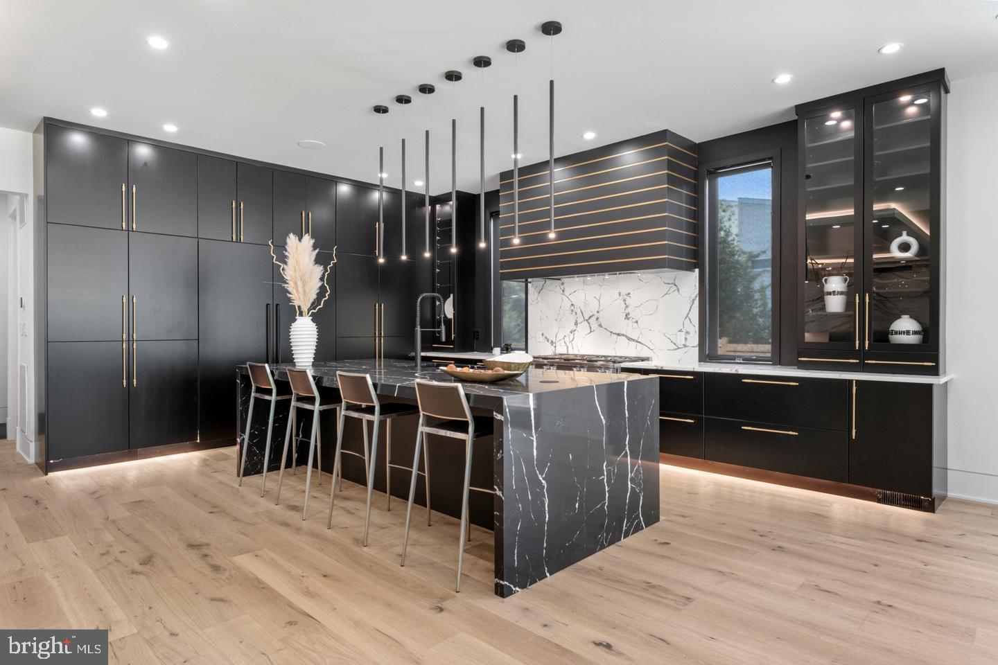 1138 Basil Road McLean, VA 22101 - Photo 4 of 24 Sleek modern kitchen with elegant finishes.