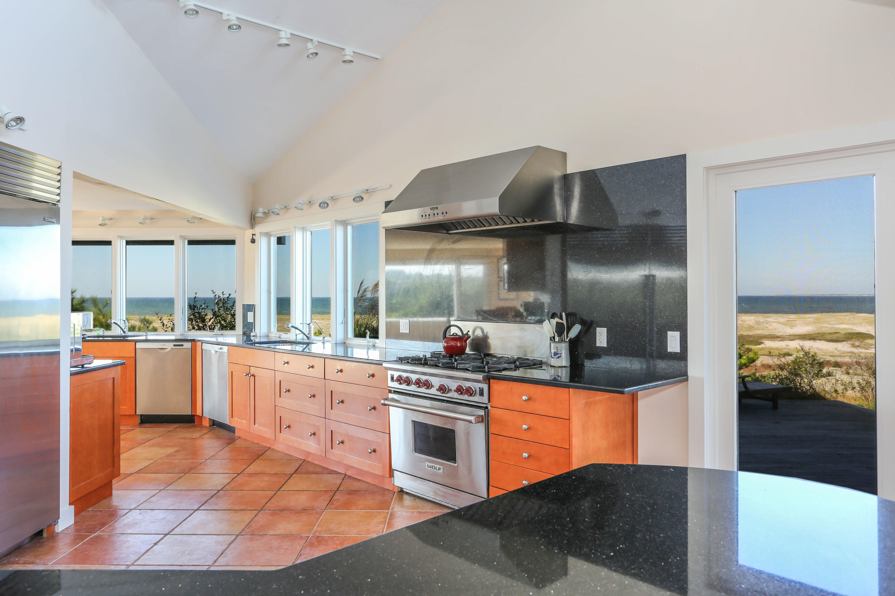20 Great Hills Road Truro, MA 02666 - Photo 11 of 29 a kitchen with stainless steel appliances granite countertop a stove and a refrigerator