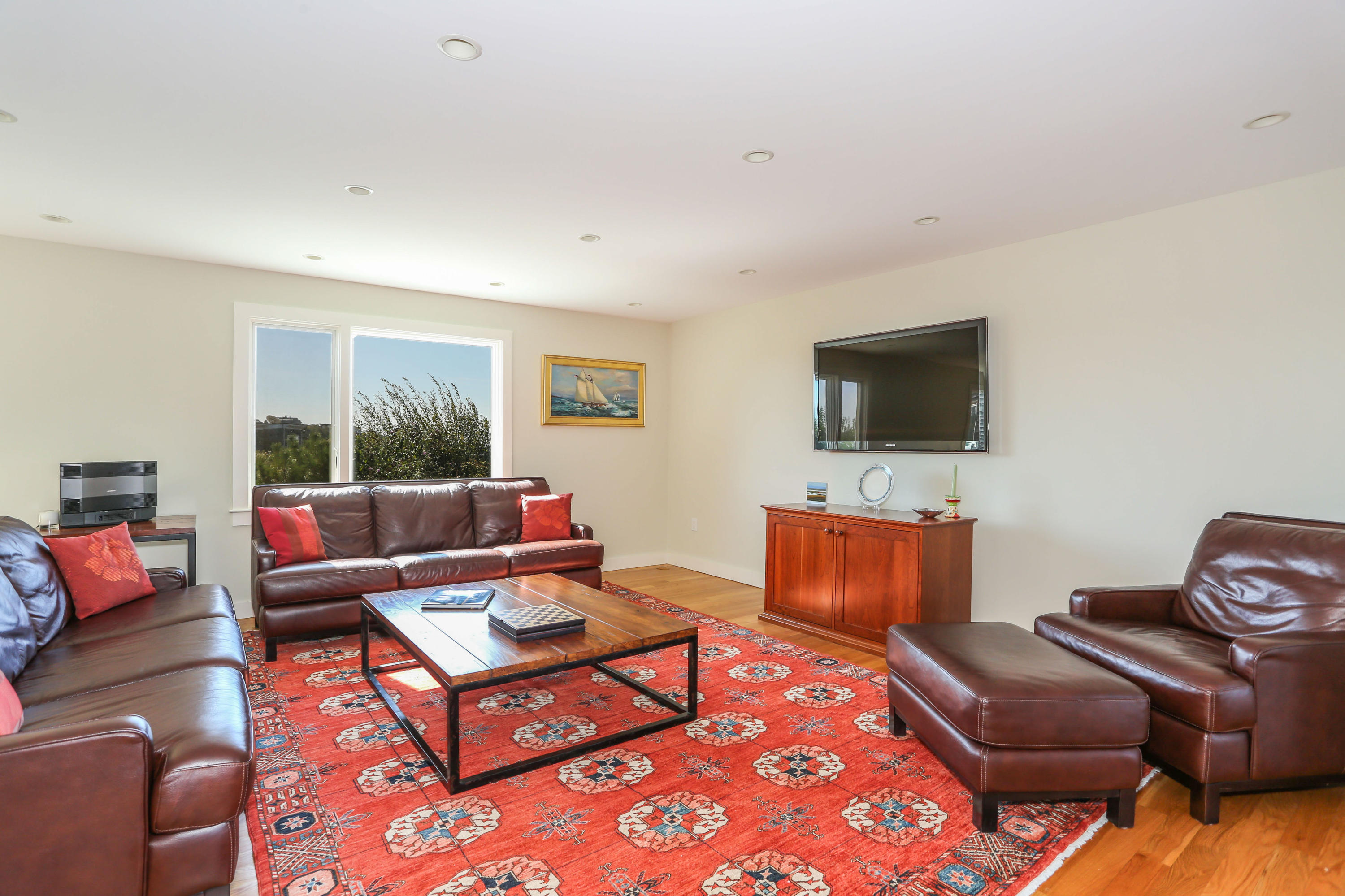 20 Great Hills Road Truro, MA 02666 - Photo 15 of 29 a living room with furniture and a flat screen tv
