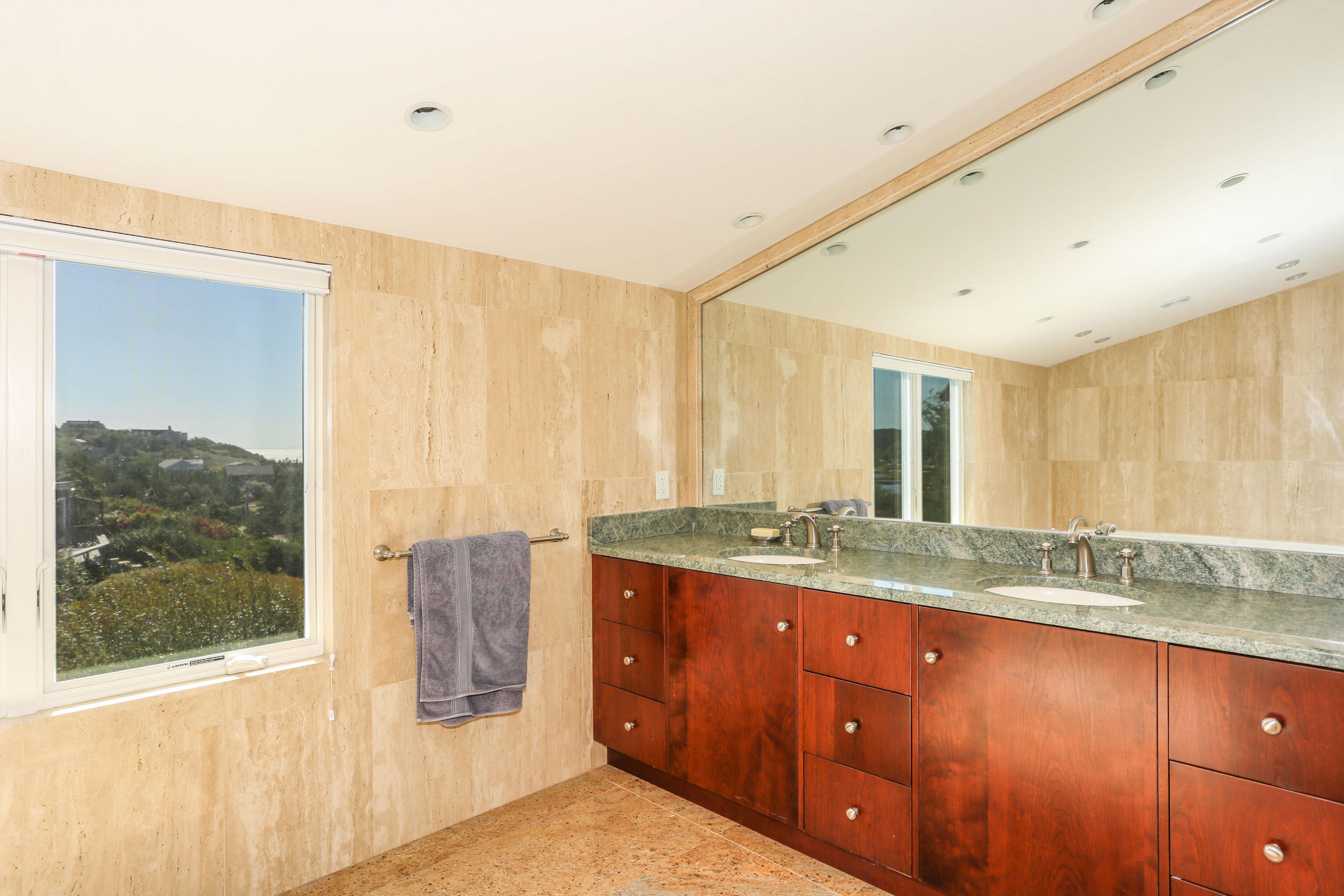 20 Great Hills Road Truro, MA 02666 - Photo 24 of 29 a bathroom with a granite countertop sink mirror and double