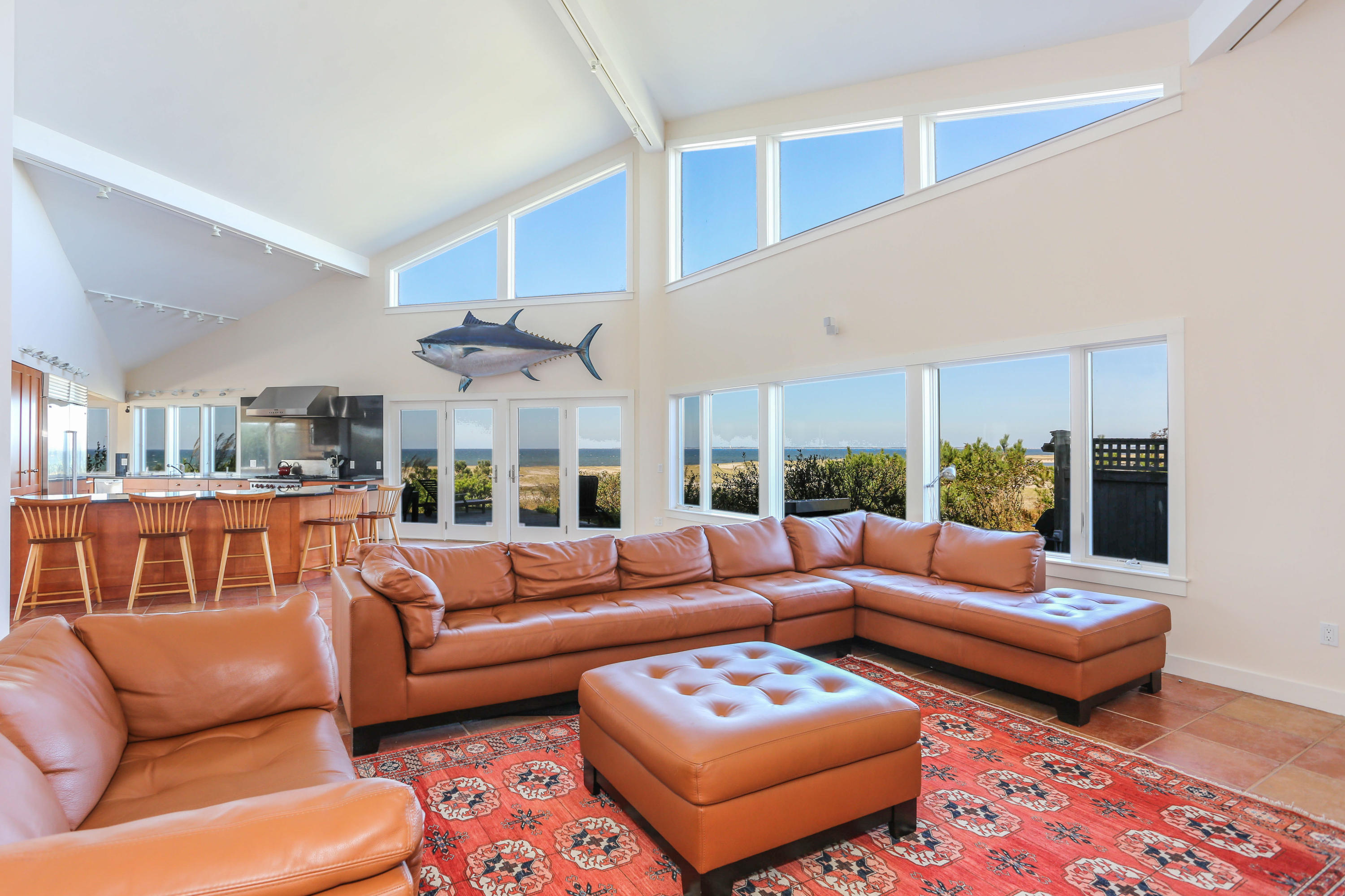 20 Great Hills Road Truro, MA 02666 - Photo 3 of 29 a living room with furniture ceiling fan and a rug