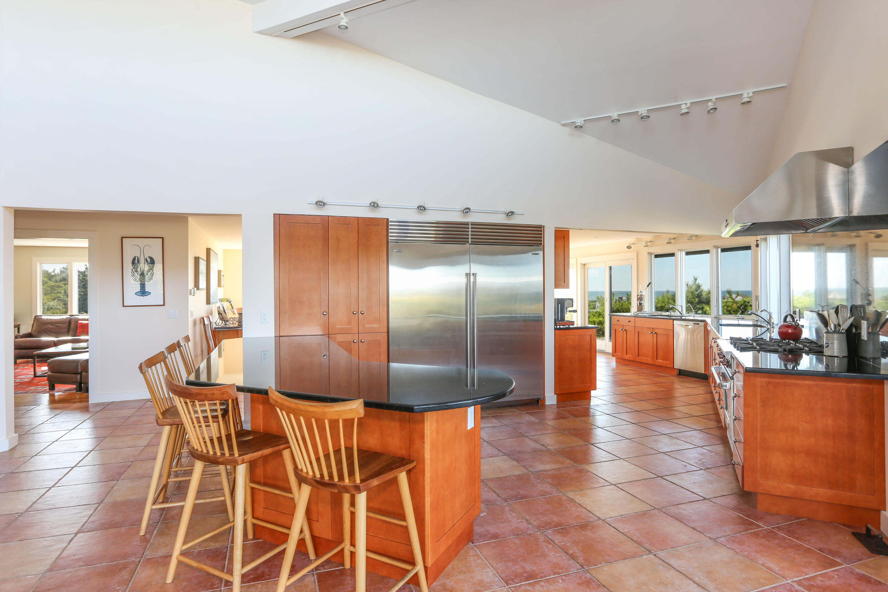 20 Great Hills Road Truro, MA 02666 - Photo 10 of 29 a dining hall with stainless steel appliances a dining table and chairs