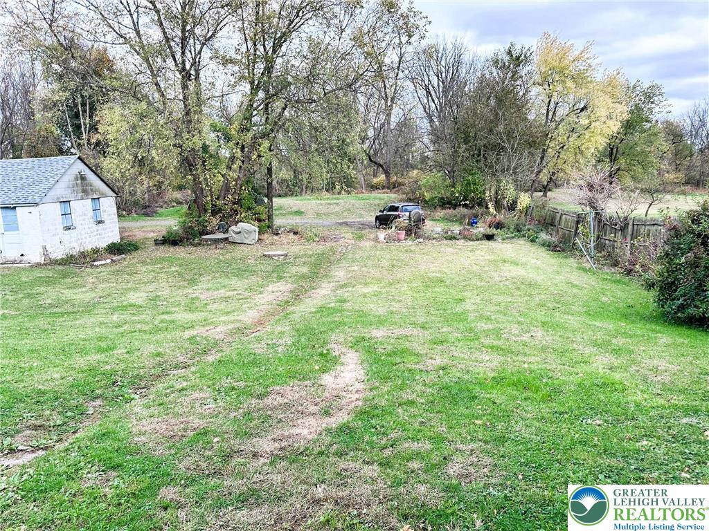 3783 Huckleberry Road Allentown, PA 18104 - Photo 22 of 27 a backyard of a house with table and chairs