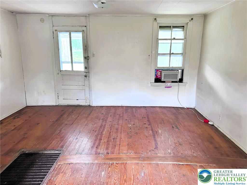 3783 Huckleberry Road Allentown, PA 18104 - Photo 10 of 27 a view of a room with wooden floor and windows