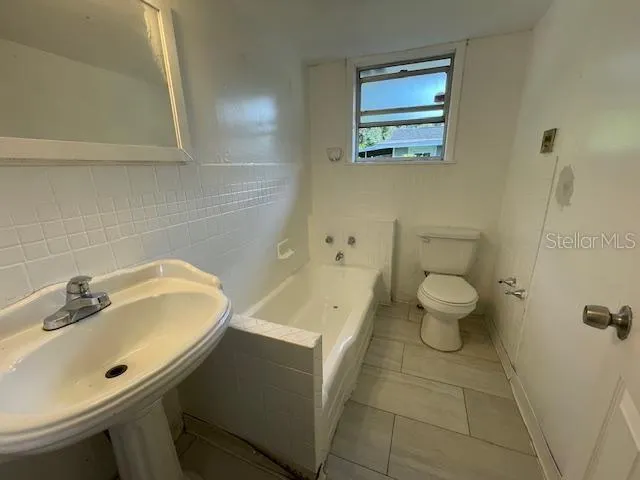 a bathroom with a sink and a toilet