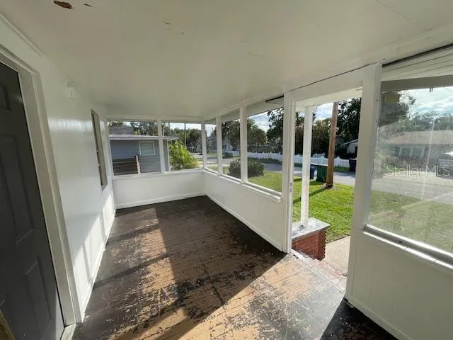 a view of a porch and garden