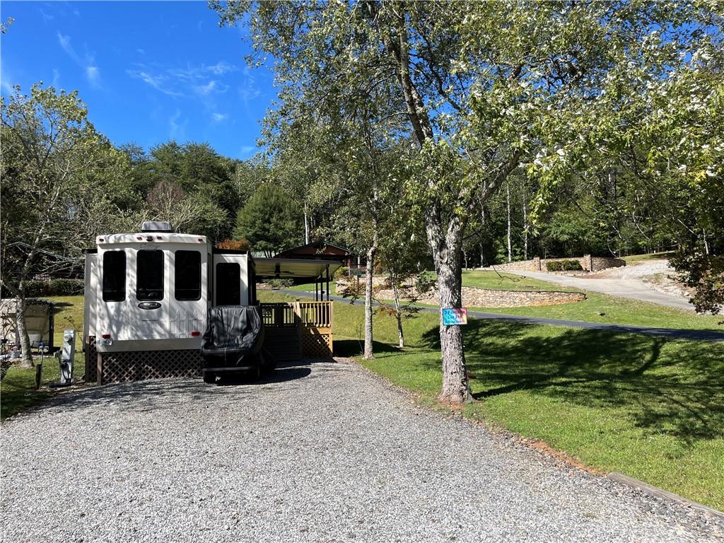 a view of a house with backyard space and sitting area