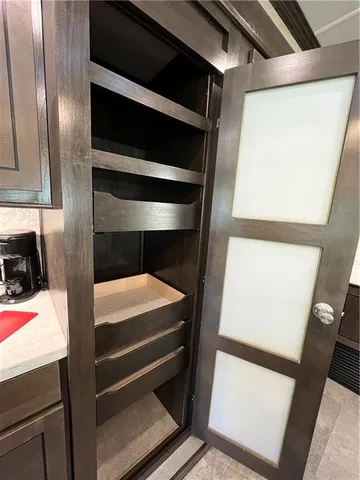 a bedroom with a bed and a microwave