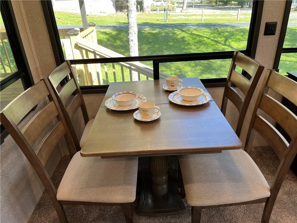 94 Bridge Loop Drive Cleveland, GA 30528 - Photo 24 of 79 a view of an outdoor dining room with furniture window