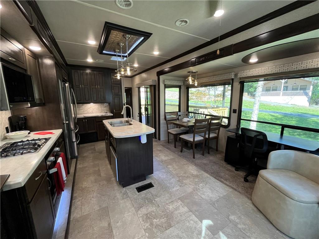 94 Bridge Loop Drive Cleveland, GA 30528 - Photo 26 of 79 a living room with furniture and a flat screen tv