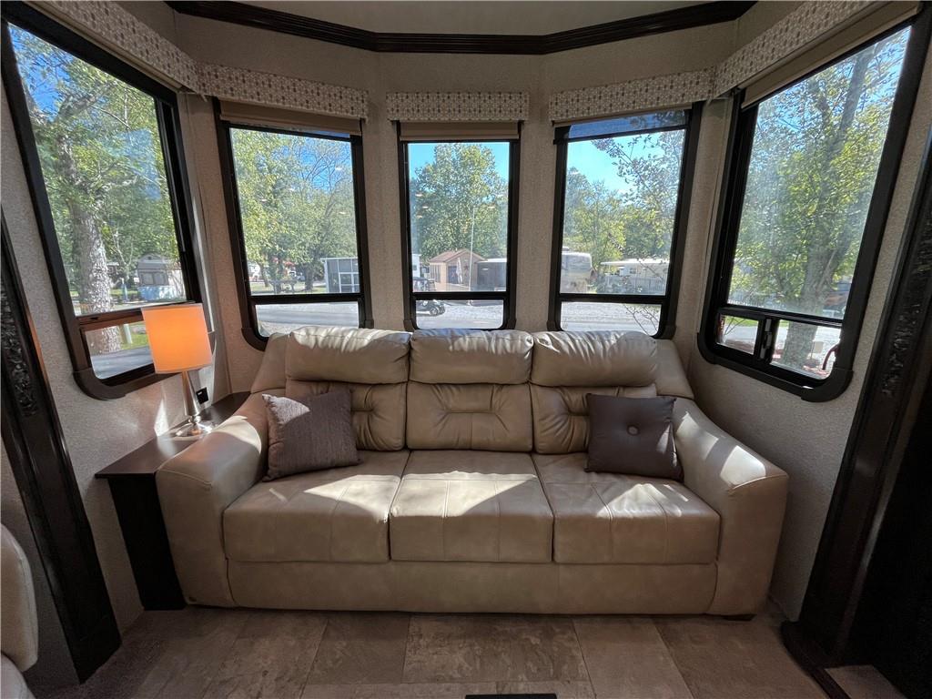 94 Bridge Loop Drive Cleveland, GA 30528 - Photo 29 of 79 a living room with furniture and a large window