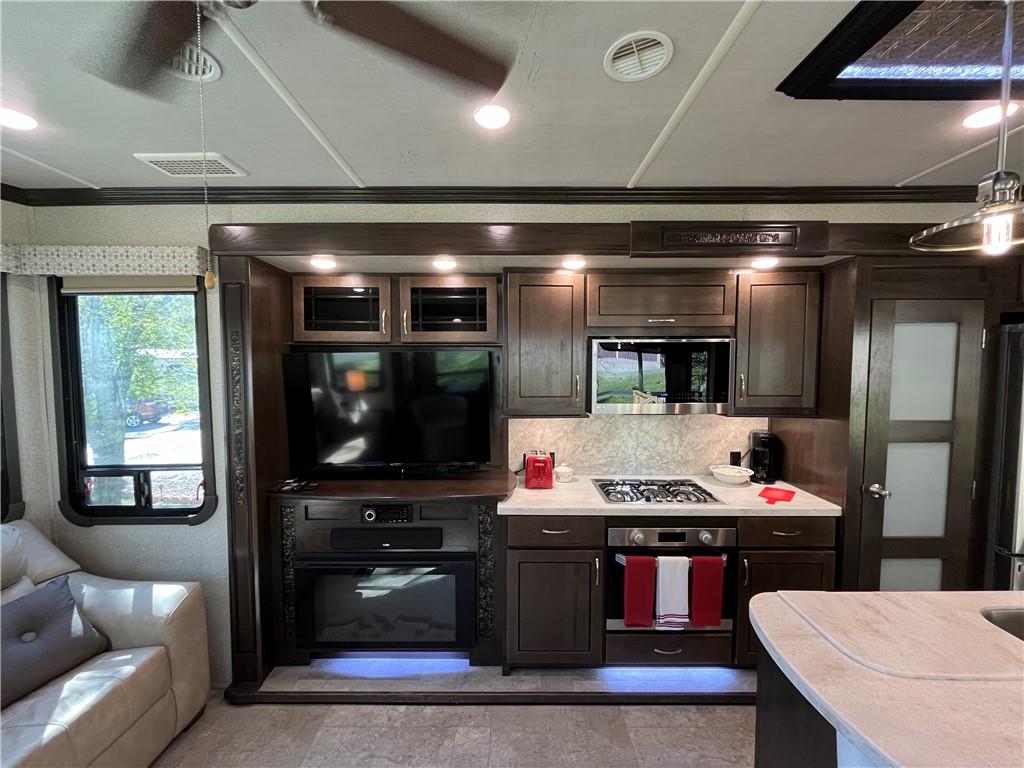 94 Bridge Loop Drive Cleveland, GA 30528 - Photo 30 of 79 a room with stainless steel appliances kitchen island granite countertop a refrigerator and a stove