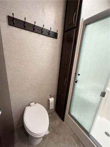 a view of a two chairs in the patio