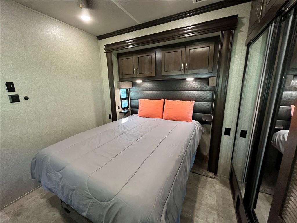 94 Bridge Loop Drive Cleveland, GA 30528 - Photo 37 of 79 a bedroom with a bed and a microwave