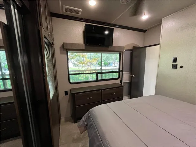 a view of outdoor space with a table and chairs