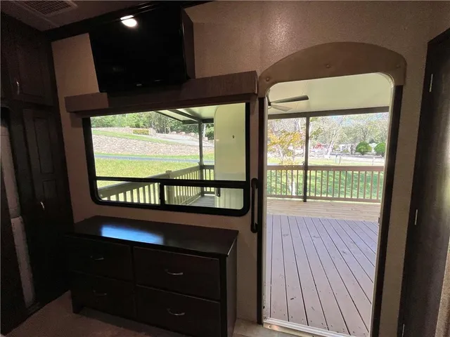 a view of a patio with a table and chairs