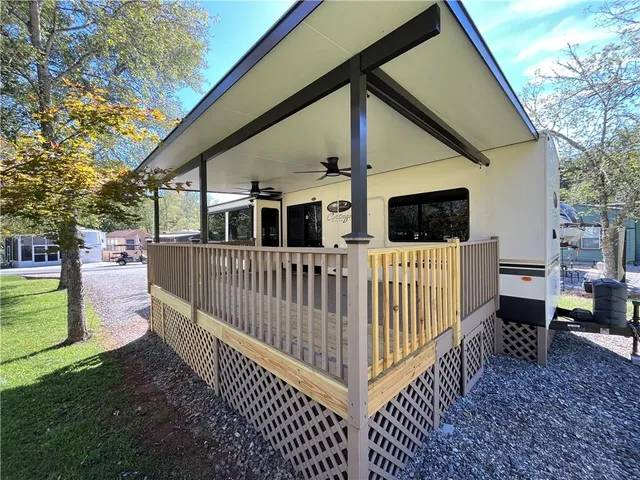 a view of a patio with a table and chairs