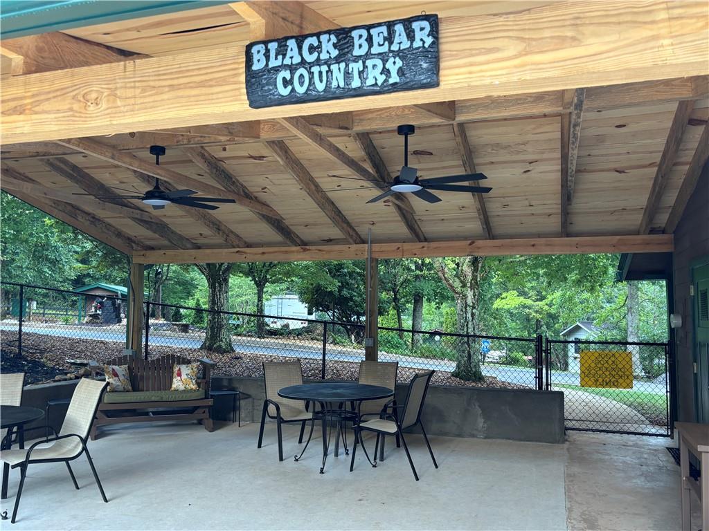 94 Bridge Loop Drive Cleveland, GA 30528 - Photo 65 of 79 a view of a patio with a table and chairs