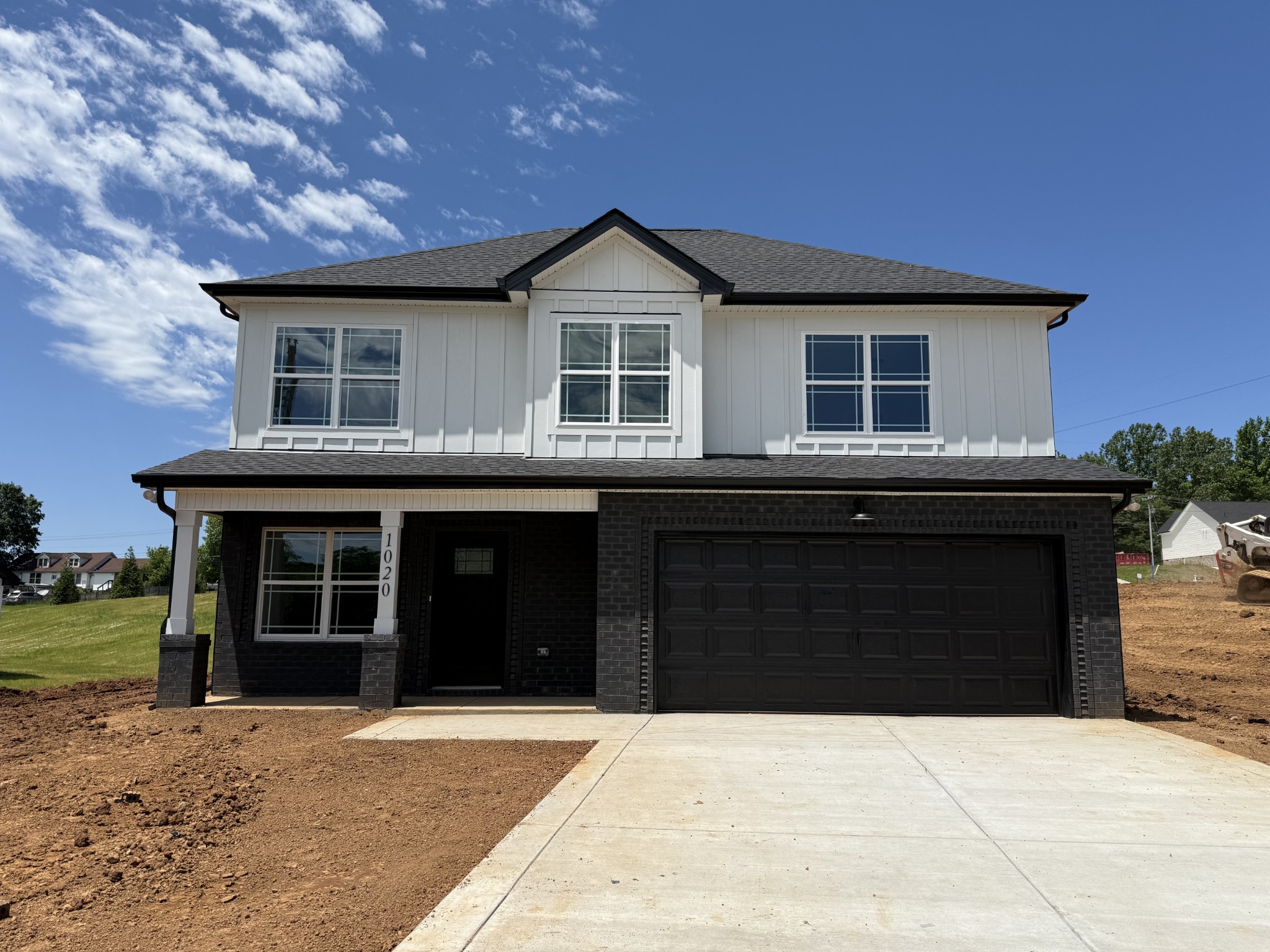 a black and white building with a large window