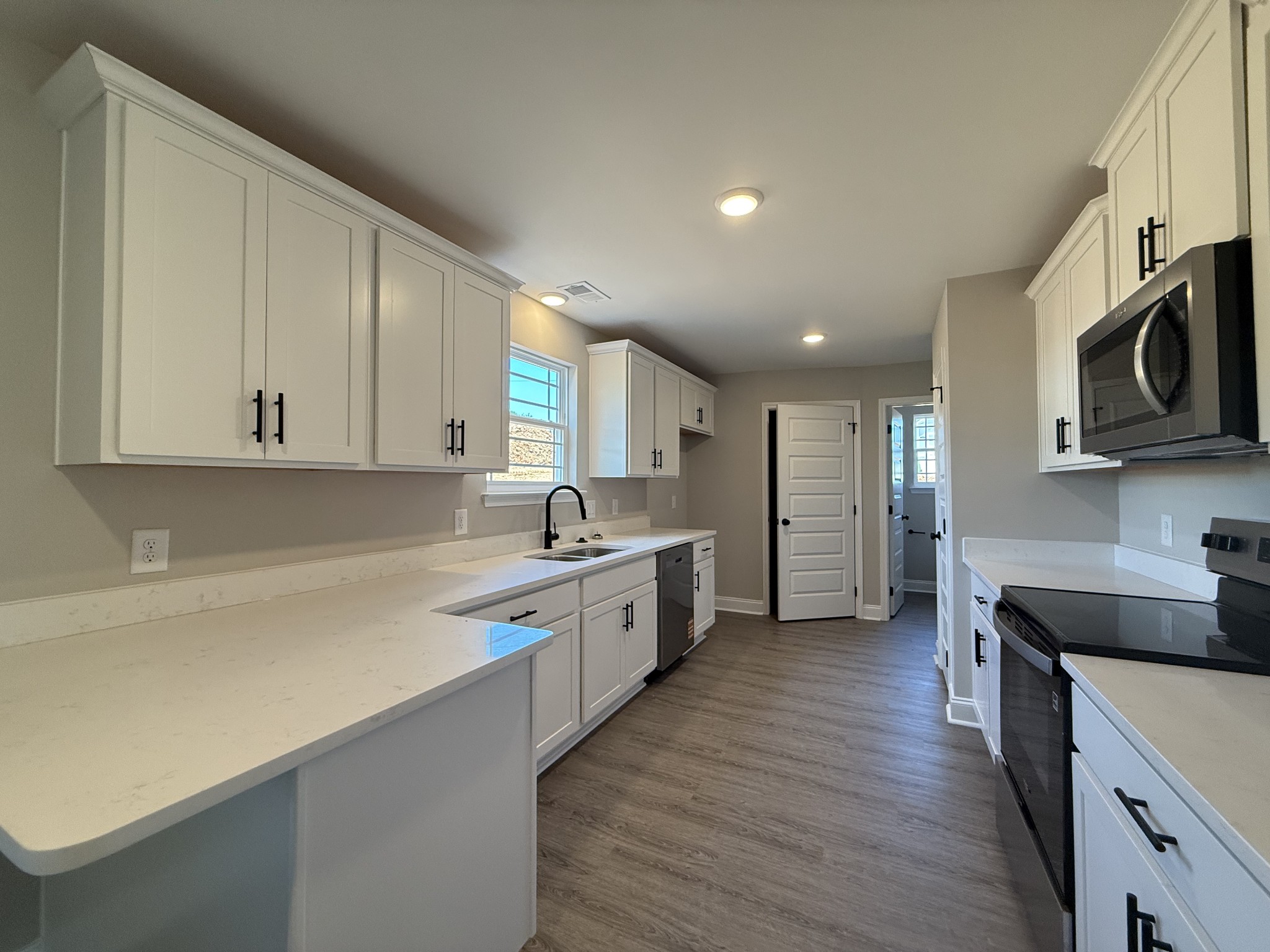 1020 Northside Drive Dickson, TN 37055 - Photo 2 of 10 a large kitchen with stainless steel appliances granite countertop a lot of counter space and wooden floor