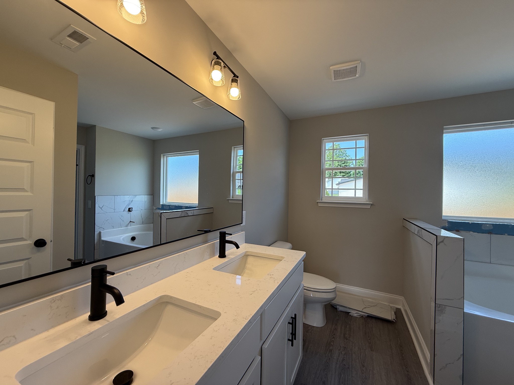 1020 Northside Drive Dickson, TN 37055 - Photo 7 of 10 a bathroom with a sink a toilet and a mirror