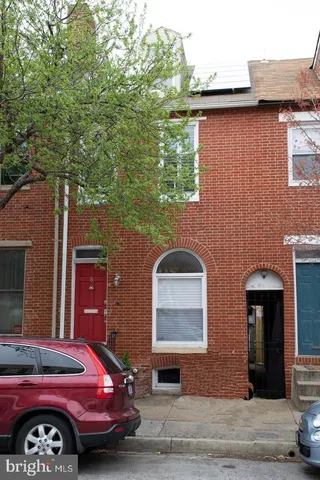 a front view of a house with parking