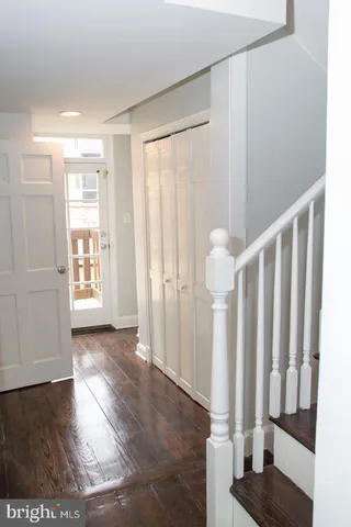a view of entryway with wooden floor