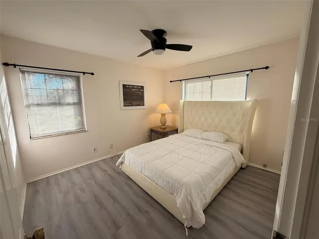 a bedroom with bed and window