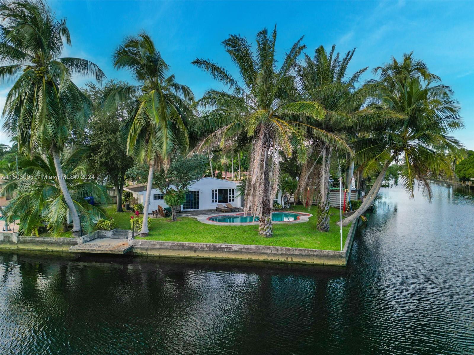 2702 Scott Street Hollywood, FL 33020 - Photo 11 of 42 a view of swimming pool and lake view