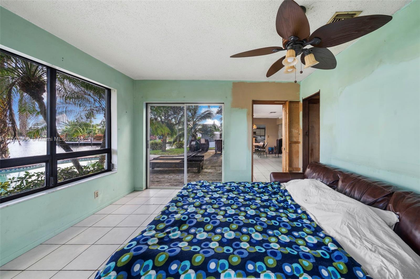 2702 Scott Street Hollywood, FL 33020 - Photo 19 of 42 a bedroom with a bed and a large window