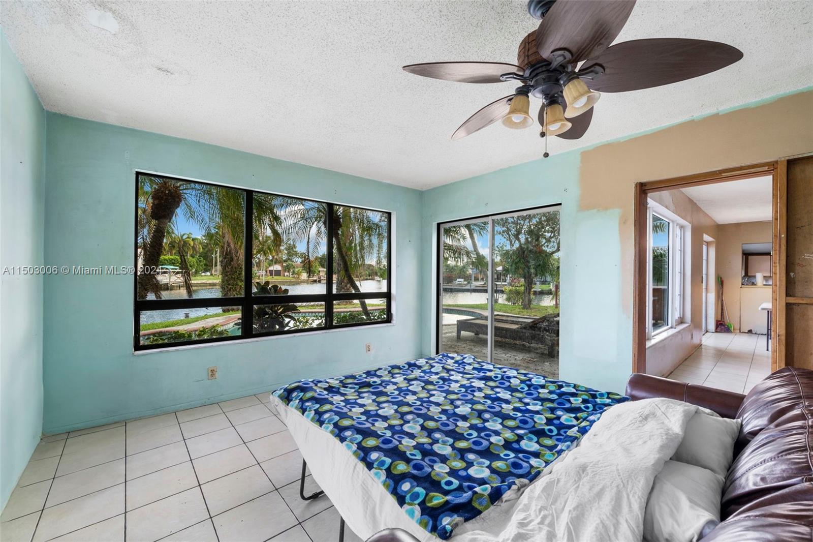 2702 Scott Street Hollywood, FL 33020 - Photo 33 of 42 a bedroom with a bed and a large window