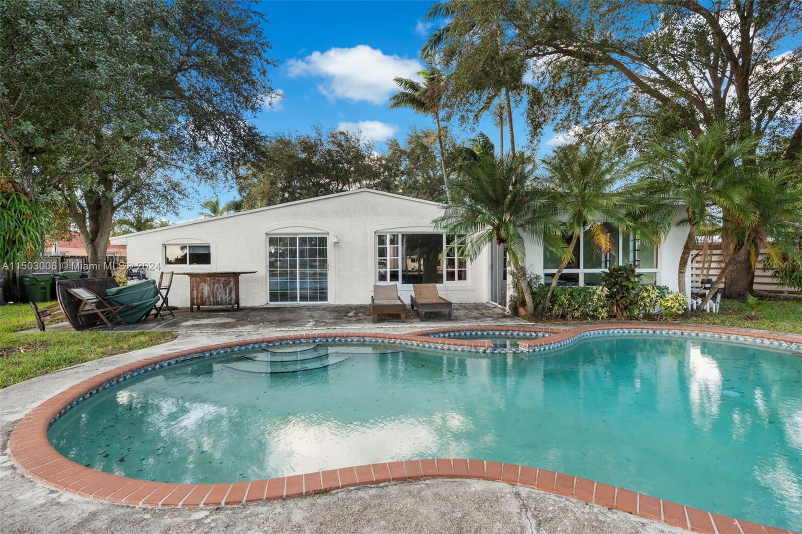 2702 Scott Street Hollywood, FL 33020 - Photo 38 of 42 a view of a house with swimming pool and sitting area
