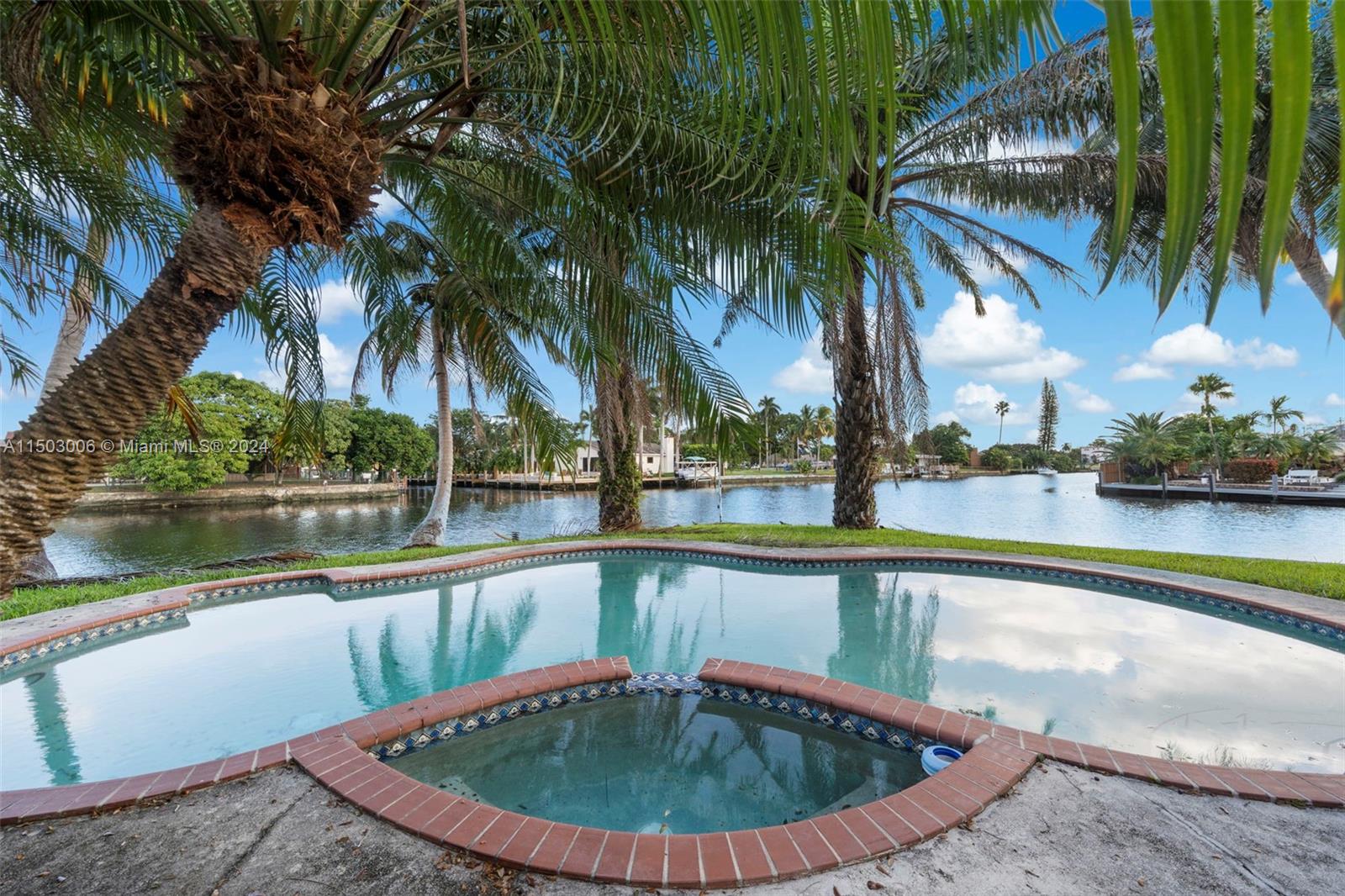 2702 Scott Street Hollywood, FL 33020 - Photo 40 of 42 a view of a swimming pool with a potted plants