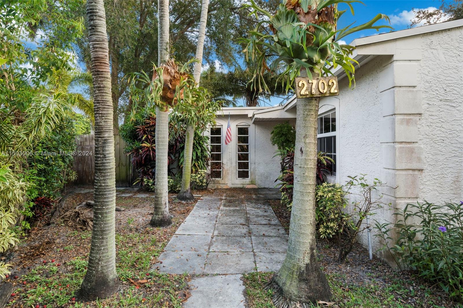 2702 Scott Street Hollywood, FL 33020 - Photo 4 of 42 a front view of a house with garden